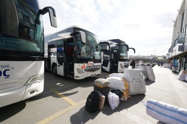 ISTANBUL, TURKIYE - APRIL 06, 2024: People in Esenler Coach Terminal in Istanbul. Terminal is the central and largest bus terminus for intercity bus service in Istanbul clipart