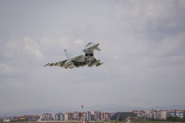 KONYA, TURKIYE - MAY 09, 2023: United Kingdom Royal Air Force Eurofighter Typhoon FGR4 (BS083-322) take-off from Konya Airport during Anatolian Eagle Air Force Exercise clipart