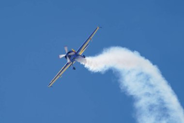 ESKISEHIR, TURKIYE - SEPTEMBER 16, 2023: Romanian Hawks Aerobatics Team Extra 330SC displayed at Sivrihisar SHG Airshow clipart