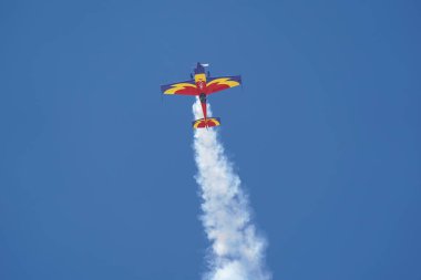 ESKISEHIR, TURKIYE - SEPTEMBER 17, 2023: Romanian Hawks Aerobatics Team Extra 330SC (SC100) displayed at Sivrihisar SHG Airshow clipart