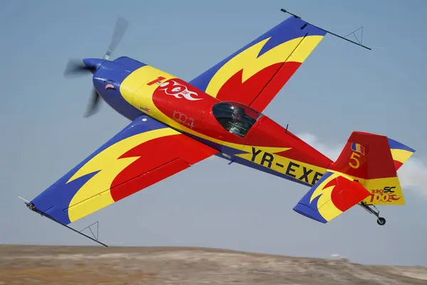 stock image ESKISEHIR, TURKIYE - SEPTEMBER 17, 2023: Romanian Hawks Aerobatics Team Extra 330SC (SC100) displayed at Sivrihisar SHG Airshow