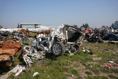 HATAY, TURKIYE - FEBRUARY 26, 2024: Crushed Vehicles during 6 February 2023 Hatay Earthquakes clipart