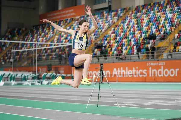 stock image ISTANBUL, TURKIYE - FEBRUARY 17, 2024: Undefined athlete triple jumping during Turkish Indoor Athletics Championships in Atakoy Athletics Arena