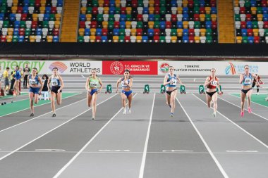 ISTANBUL, TURKIYE - FEBRUARY 10, 2024: Athletes running 60 metres during Balkan Athletics Championships in Atakoy Athletics Arena clipart