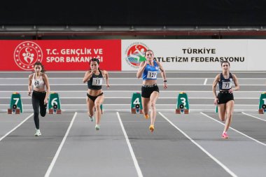 ISTANBUL, TURKIYE - FEBRUARY 17, 2024: Athletes running 60 metres during Turkish Indoor Athletics Championships in Atakoy Athletics Arena clipart