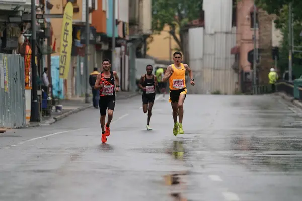 stock image ISTANBUL, TURKIYE - APRIL 28, 2024: Athletes running Istanbul half marathon in historic street of Fener district