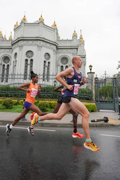 stock image ISTANBUL, TURKIYE - APRIL 28, 2024: Athletes running Istanbul half marathon in historic street of Fener district