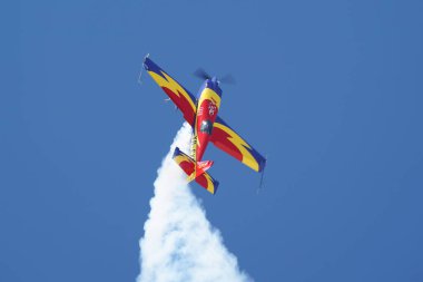 ESKISEHIR, TURKIYE - SEPTEMBER 17, 2023: Romanian Hawks Aerobatics Team Extra 330SC (SC100) displayed at Sivrihisar SHG Airshow clipart