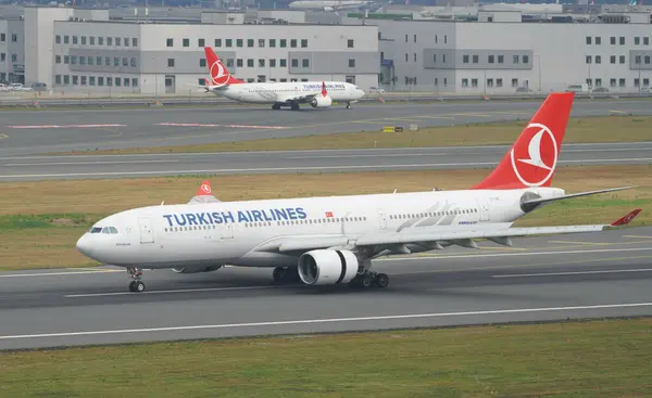 stock image ISTANBUL, TURKIYE - JUNE 17, 2023: Turkish Airlines Airbus A330-223 (869) landing to Istanbul International Airport