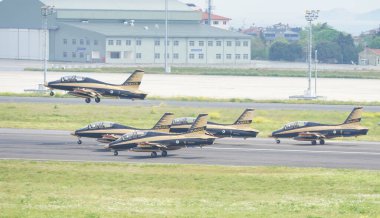 ISTANBUL, TURKIYE - MAY 01, 2023: Fursan Al Emarat, United Arab Emirates Air Force aerobatic demonstration team display in Istanbul Ataturk Airport during Teknofest Istanbul clipart