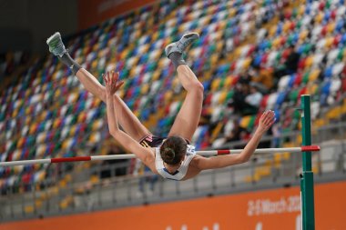 ISTANBUL, TURKIYE - FEBRUARY 10, 2024: Undefined athlete high jumping during Balkan Athletics Championships in Atakoy Athletics Arena clipart