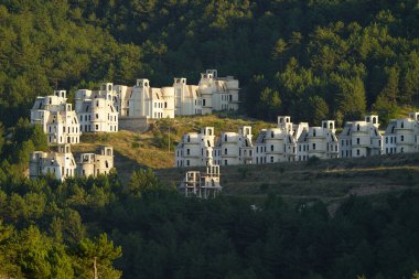 BOLU, TURKIYE - JULY 18, 2024: Burj Al Babas abandoned villas in Mudurnu Town clipart