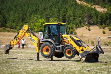 BURSA, TURKIYE - JULY 28, 2024: JCB 3CX Backhoe loader clipart