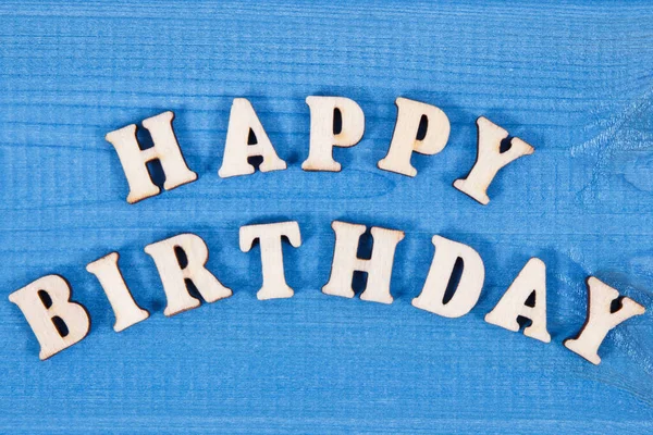 Inscription happy birthday on blue boards. Surprise for birthday occasion