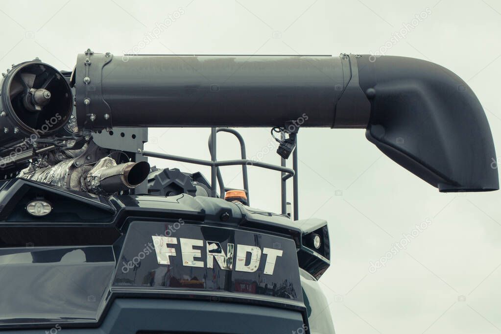 Bednary, Poland - September 25, 2021: Agroshow. Fendt brand combine harvester machine. Manufacturer agricultural and industrial equipment. Detail and part of vehicle