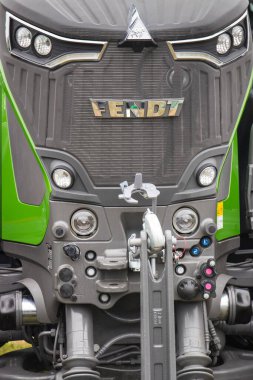Bednary, Poland - September 25, 2021: Agroshow. Fendt brand tractor machine. Manufacturer agricultural and industrial equipment. Detail and part of vehicle