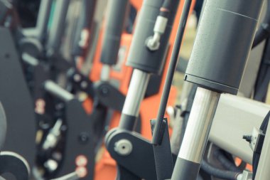 Black pistons or actuators in pneumatic or hydraulic machine. Technology and engineering