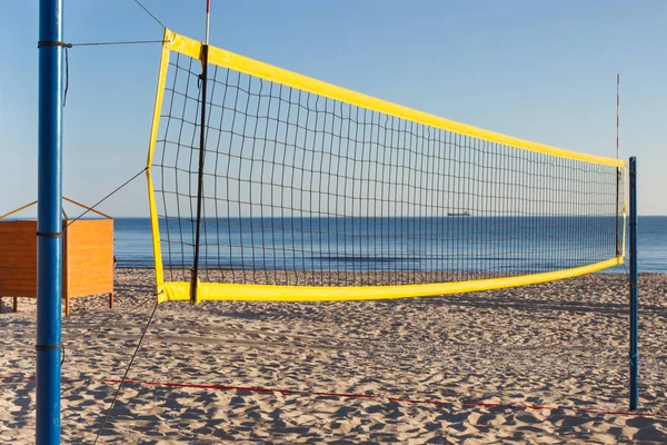 stock image Volleyball yellow net on sand at beach. Sport, recreation and healthy lifestyles on fresh air