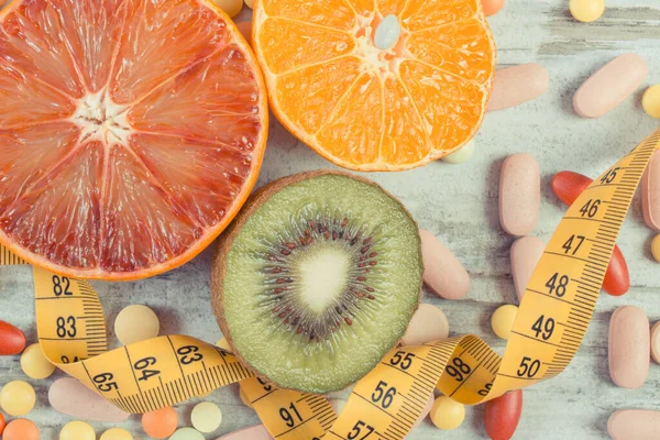 Fresh Natural Fruits Containing Vitamins Tape Measure Medical Pills Choice — Stock Photo, Image