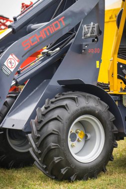 Bednary, Poland - September 25, 2021: Agroshow. Forklift or loader with Schmidt brand logo. Manufacturer of agricultural and industrial equipment. Detail and part of vehicle