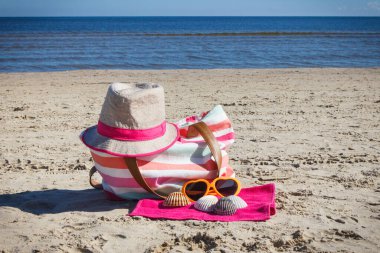 Accessories for relax or sunbathing on sand at beach. Travel and vacation time concept