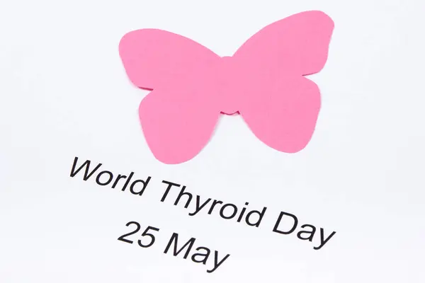 stock image Pink thyroid shape made of paper and inscription World Thyroid Day 25 May. Problems with thyroid. White background