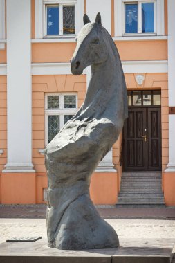 Konin, Poland - June 3, 2017: View on legendary symbolic horse statue in Polish town Konin at Plac Wolnosci square. Greater Poland province clipart