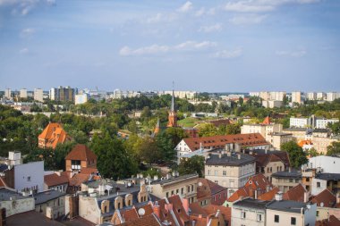 Torun, Poland - August 19, 2022: View from tower on old or modern buildings in center of polish city Torun