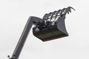 Saman balyalarını taşımak için kullanılan endüstriyel ya da tarımsal yükleyici makine. Hidrolik ve pnömatik mekanizma. Teknoloji