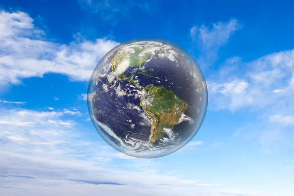 Planet earth protected inside glass sphere. Concept of climate change control, environmental conservation, ecology or green movement. Element of this image used with permission by NASA https://visibleearth.nasa.gov/images/54388/earth-the-blue-marble/