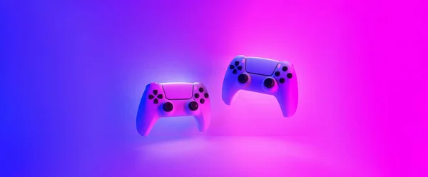 創造的なカラフルなゲームバナー サイバーパンクスタイルの青とピンクのネオンライトによって照らされた2つのジョイパッドが浮かんでいます コピースペース 3Dレンダリング — ストック写真