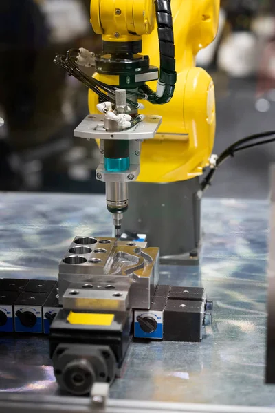 operator grinding and inspection high precision automotive part deburring and trimming