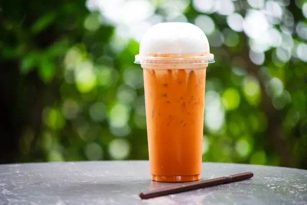 Fresh Thai Tea Milk Transparent Plastic Green Nature Background — Stock Photo, Image