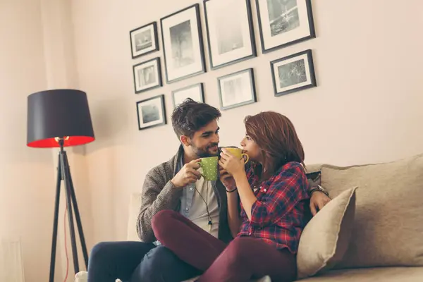 Couple Sitting Sofa Living Room Drinking Coffee Enjoying Leisure Time — Stock Photo, Image