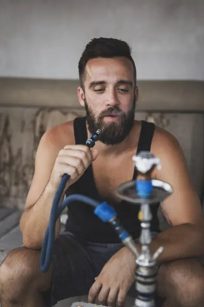 Man Inhaling Fruity Flavored Molasses Based Tobacco Using Water Pipe — Stock Photo, Image