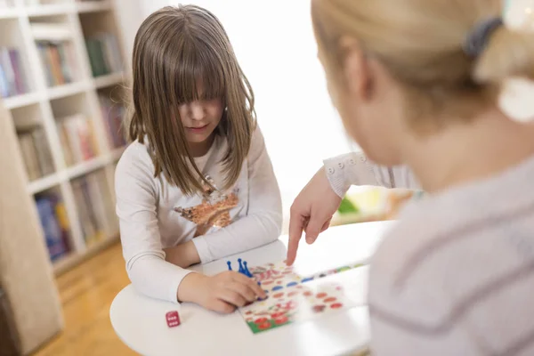 Mother Daughter Sitting Playroom Playing Ludo Game Daughter Repositioning Pawn — Stock Photo, Image