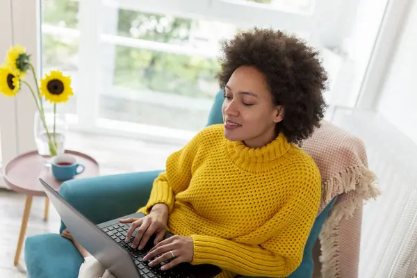 Beautiful Mixed Race Woman Sitting Armchair Relaxing Home Using Laptop — Stock Photo, Image
