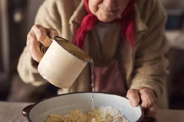 Detail Elderly Woman Hand Pouring Water Flour While Making Homemade — Stock Photo, Image