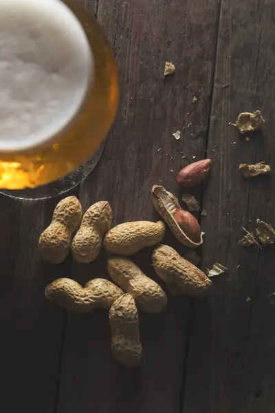 Top View Glass Cold Pale Beer Some Peanuts Rustic Wooden — Stock Photo, Image