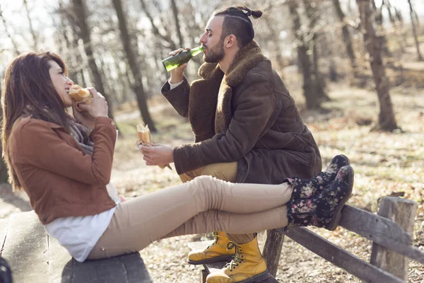 Young Couple Sitting Wooden Bench Forest Road Taking Break While — Stock Photo, Image