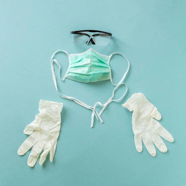 Medical face protection mask, protective gloves and lab glasses as part of prevention gear against bacterial and viral infections; covid-19 prevention medical equipment