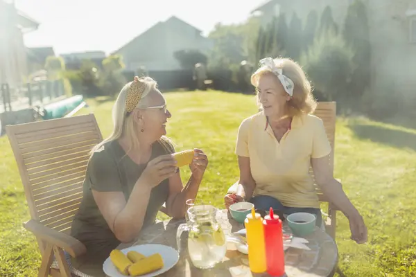 Two Elderly Women Sitting Table Having Lunch Outdoors Relaxing Having — Stock Photo, Image