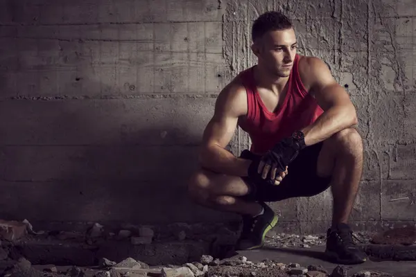 Muscular Young Athletic Built Sportsman Crouching Next Concrete Wall Abandoned — Stock Photo, Image