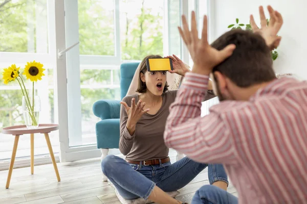 Couple Having Fun Home Playing Charades Explaining Guessing Words Smartphone — Stock Photo, Image