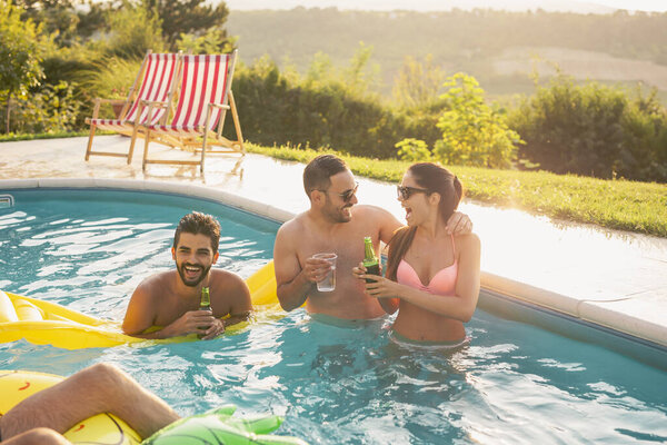 Friends at a swimming pool party