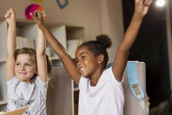 Two Little Girls Finished Homeworks Studying School Celebrating Raising Hands — Stock Photo, Image