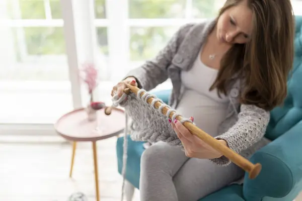 Beautiful Pregnant Woman Sitting Armchair Window Knitting Blanket Her Baby — Stock Photo, Image