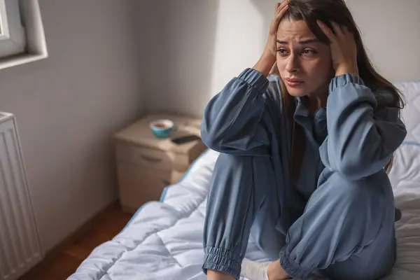Troubled Young Woman Wearing Pajamas Sitting Bed Morning Holding Head — Stock Photo, Image