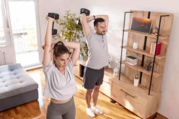 Couple Working Out Home Doing Tricep Exercises Using Dumbbells — Stock Photo, Image
