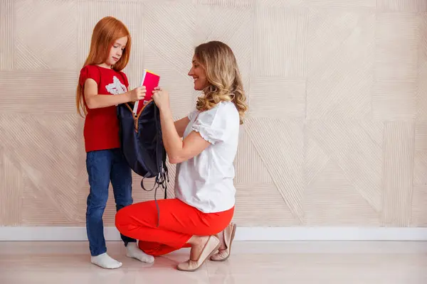 Mother Packing Her Daughter Backpack First Day School Preparing Taking — Stock Photo, Image